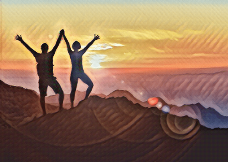 two people on a mountain at sunset with their hands in the air