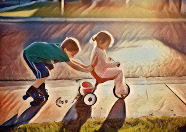 a boy on rollerskates pushes a girl on tricycle on the sidewalk