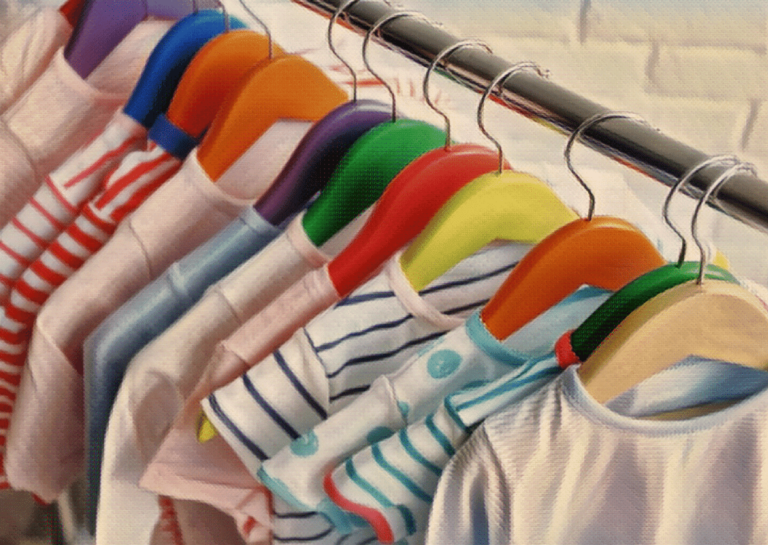 childrens clothes on hanger in closet