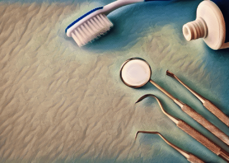 dental tools like toothbrush toothpaste laying flat on surface